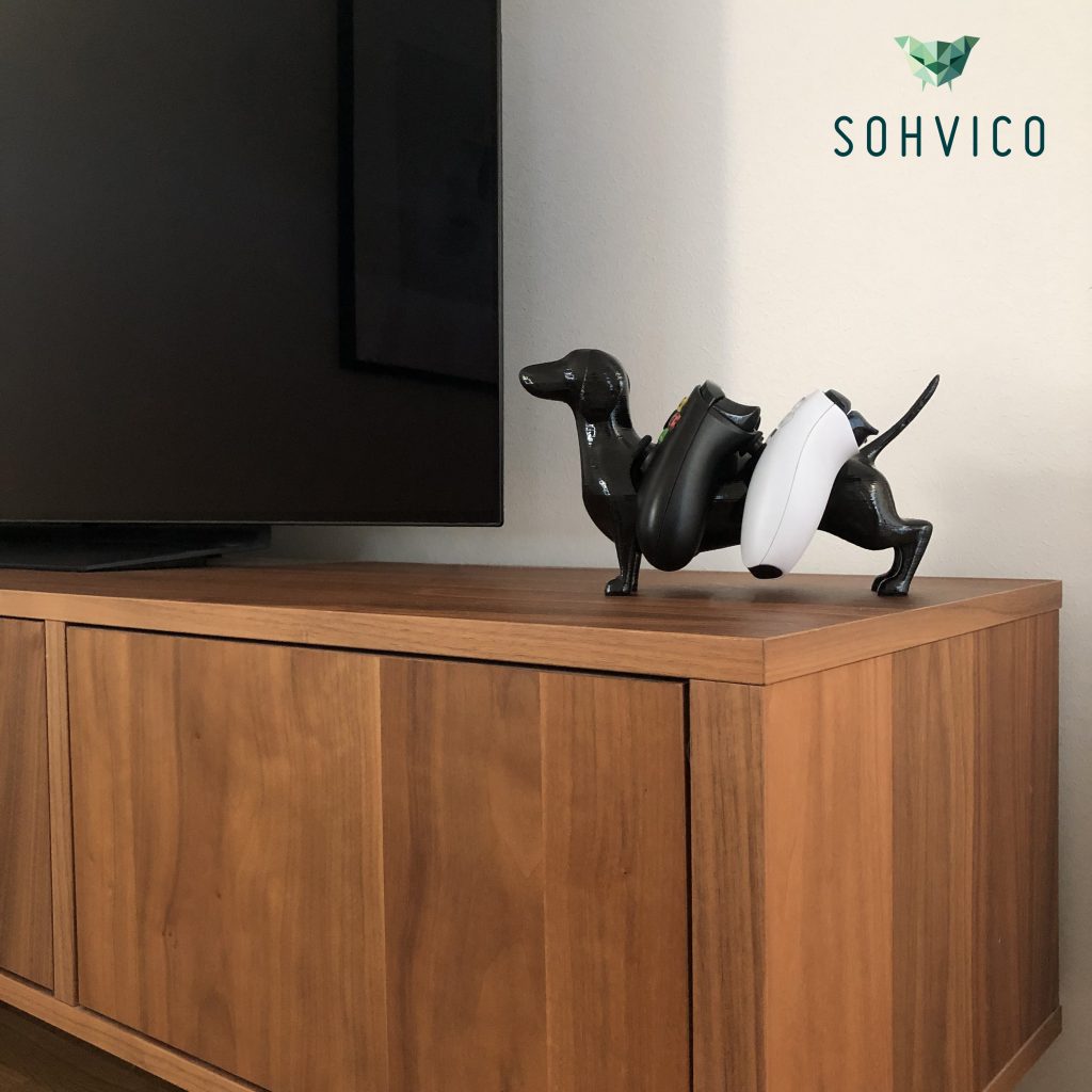 I designed this dachshund for you to keep your console controllers on the spot they deserve. Please release this dog from the spool!